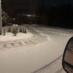 Residential sidewalk and driveway cleared after snowfall in Spearfish, South Dakota by South Dakota Services snow plowing and winter maintenance team.